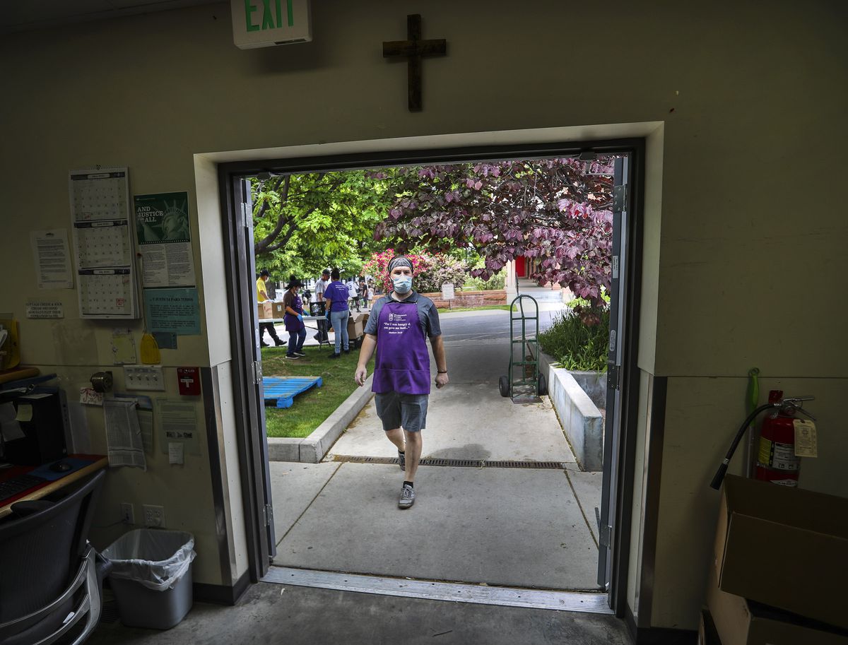 Interfaith volunteer Sheldon Hatch works at Hildegarde’s Food Pantry at St. Mark’s Cathedral in Salt Lake City on Friday, May 29, 2020. The pantry partners with several local organizations to bring food to about 2,000 households a month.