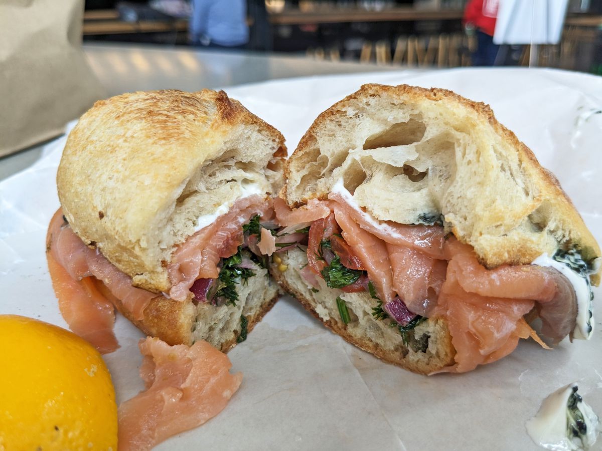 A crusty roll stuffed with salmon.