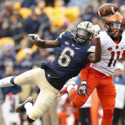 Pittsburgh wide receiver Aaron Mathews (6) is unable to make a catch before Syracuse defensive back Corey Winfield (11) intercepts the pass during the first half of an NCAA college football game in Pittsburgh, Saturday, Nov. 26, 2016.