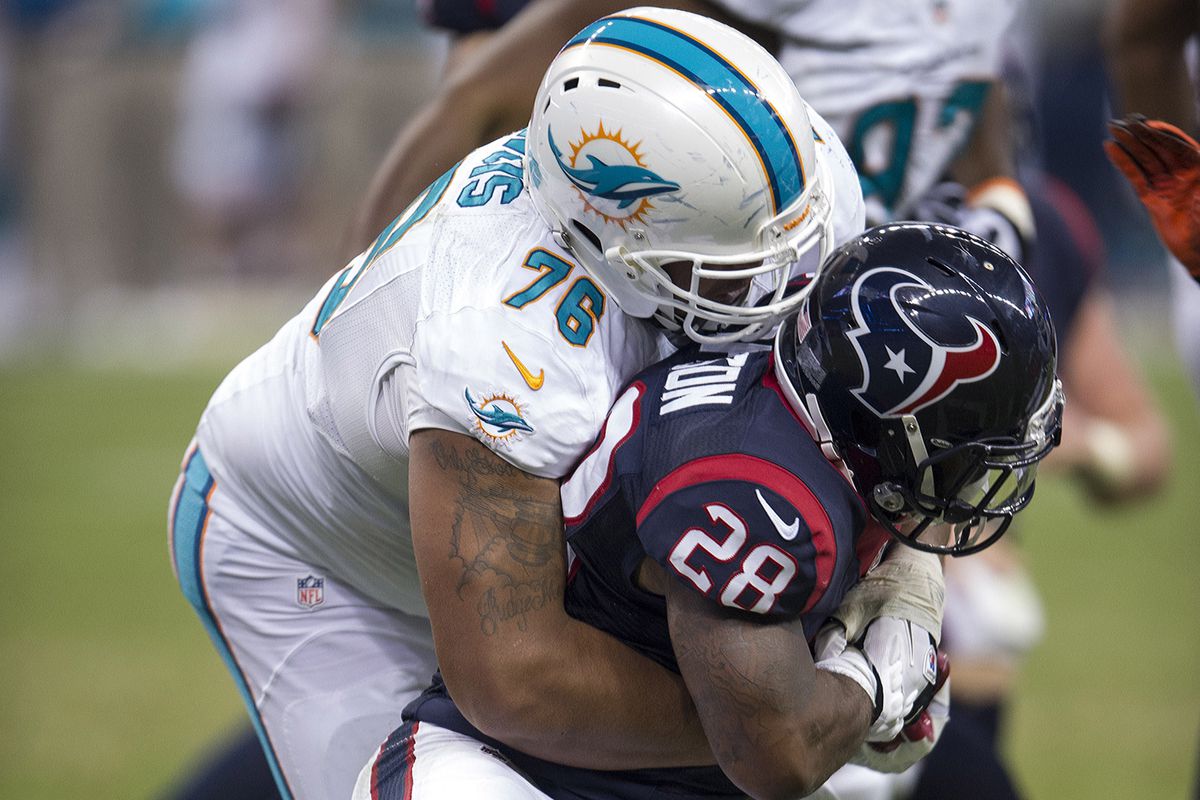 Defensive tackle A.J. Francis, here with the Miami Dolphins during the preseason, was signed by Miami off the New England Patriots practice squad today.