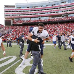 Brigham Young Cougars quarterback Tanner Mangum (12) carried after throwing the winning touchdown against Nebraska in Lincoln, NE Saturday, Sept. 5, 2015. BYU won 33-28.