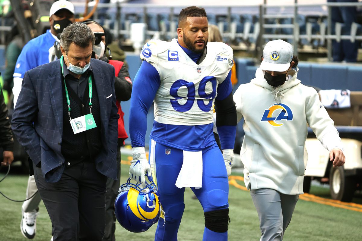 Aaron Donald #99 of the Los Angeles Rams heads to the locker room after being injured in the third quarter against the Seattle Seahawks during the NFC Wild Card Playoff game at Lumen Field on January 09, 2021 in Seattle, Washington.