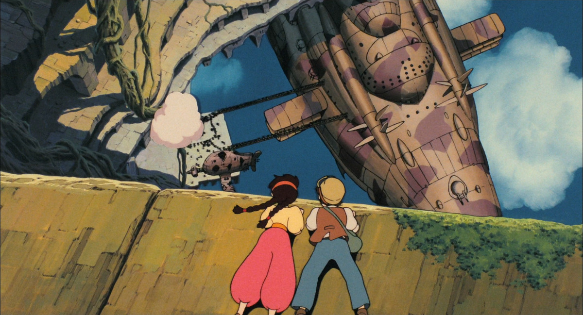 A boy and a girl, drawn in anime style, lean over a stone ledge high in the clouds and observe a giant airship docking below