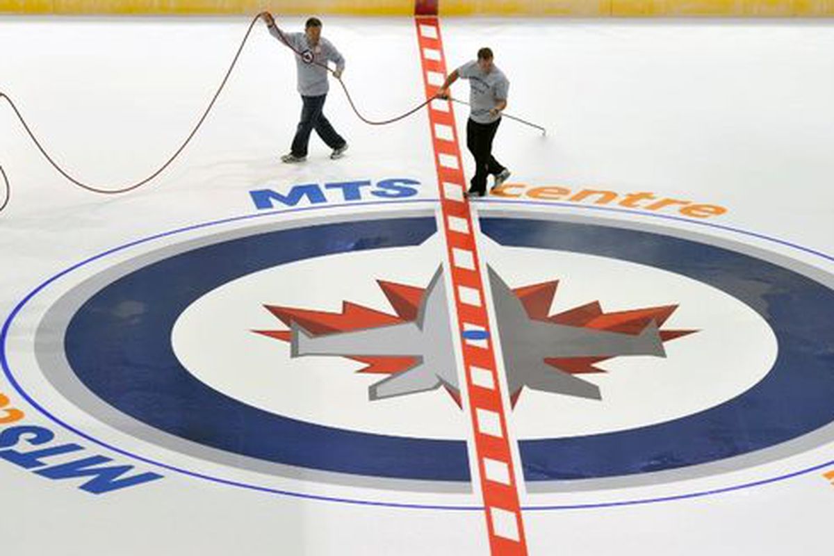 MTS Centre ice attendants prepare for tonight's match-up between the Winnipeg Jets and Montreal Canadiens