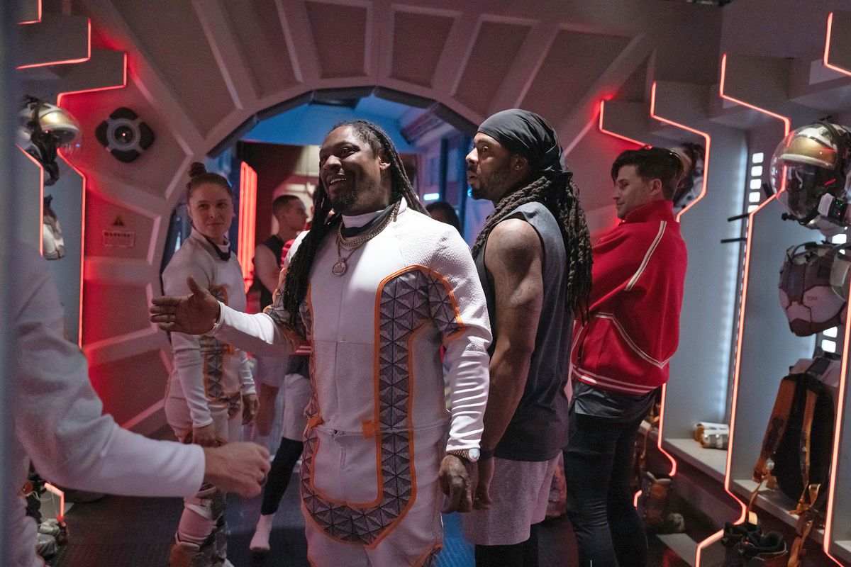 Marshawn Lynch goes to give someone a handshake in a still from Stars on Mars