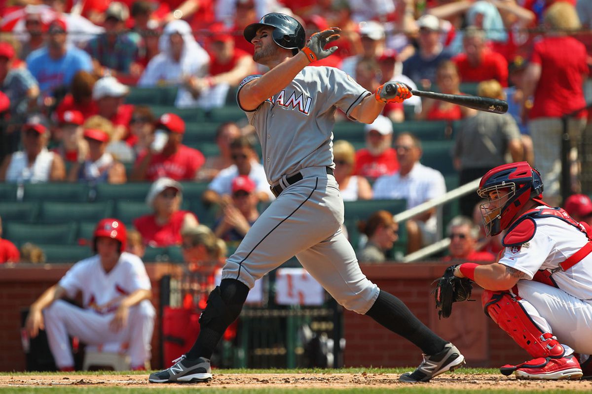 ST. LOUIS, MO - JULY 7: Justin Ruggiano #20 of the Miami Marlins hits a two-run home run against the St. Louis Cardinals at Busch Stadium on July 7, 2012 in St. Louis, Missouri.  (Photo by Dilip Vishwanat/Getty Images)