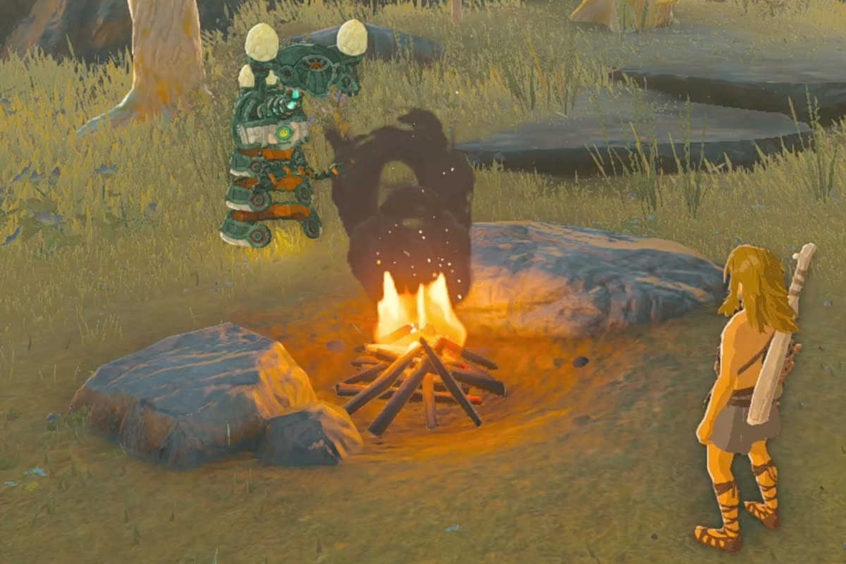 The Legend of Zelda: Tears of the Kingdom Link and a Zonai Construct at a campfire