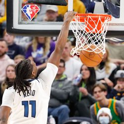 Minnesota Timberwolves center Naz Reid (11) dunks the ball during an NBA game against Utah Jazz at Vivint Arena in Salt Lake City on Thursday, Dec. 23, 2021.