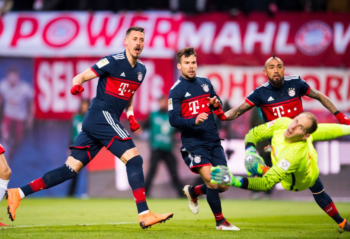 Bayern Munich's forward Sandro Wagner (L) reacts after scoring the opening goal during the German first division Bundesliga football match between RB Leipzig and FC Bayern Munich in Leipzig, eastern Germany on March 18, 2018.