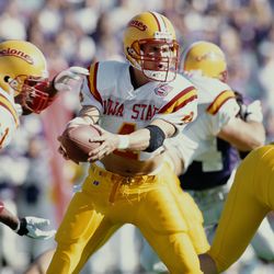 Todd Doxzon #4, Quarterback for the Iowa State Cyclones hands the ball off to Running Back #21 Graston Norris during the NCAA Big Eight Conference college football game against the Kansas State University Wildcats on 5 November 1994 at the Bill Snyder Family Stadium Wagner Field, Manhattan, Kansas, United States. The Wildcats won the game 38 - 20