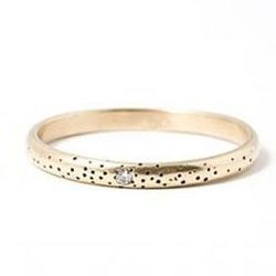 Claire Kinder Studio's speckled band with a diamond for $330