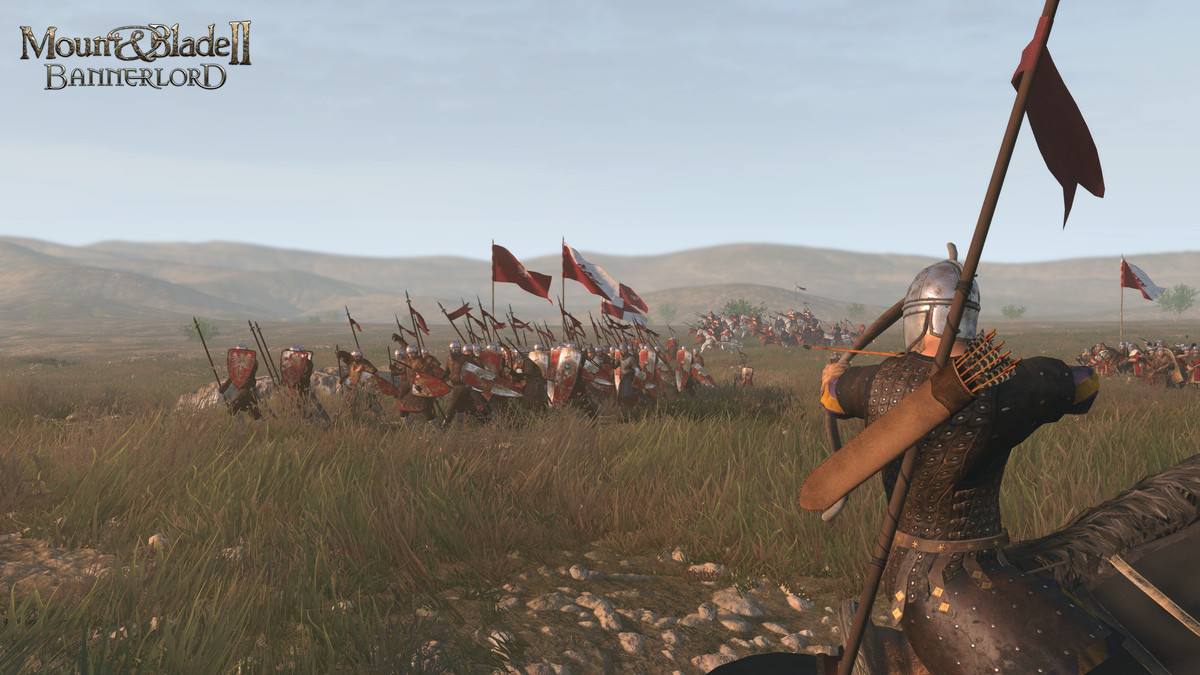Mount and Blade 2: Bannerlord. A knight looks onto a battlefield with soldiers charging forward.