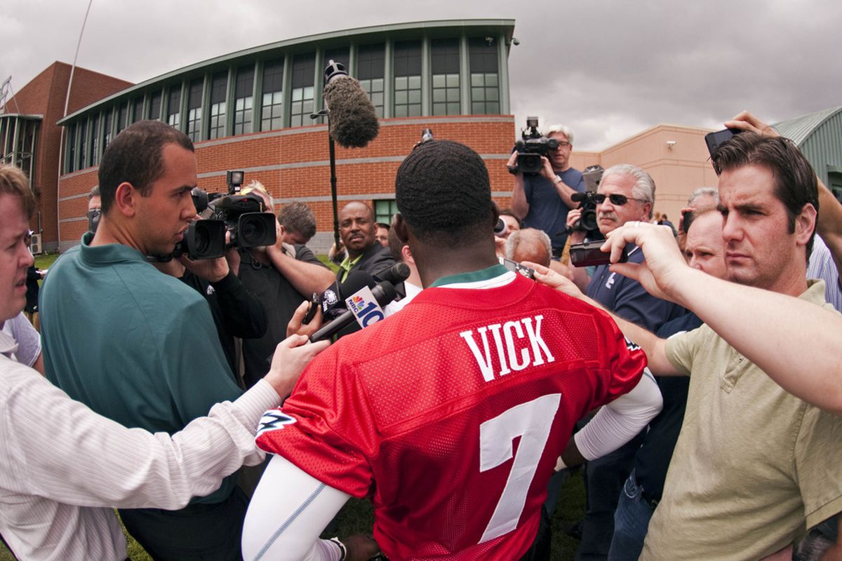 May 22, 2012; Philadelphia, PA, USA; Philadelphia Eagles quarterback Michael Vick (7) is interviewed after practice during organized team activities at the Philadelphia Eagles NovaCare Complex. Mandatory Credit: Howard Smith-US PRESSWIRE