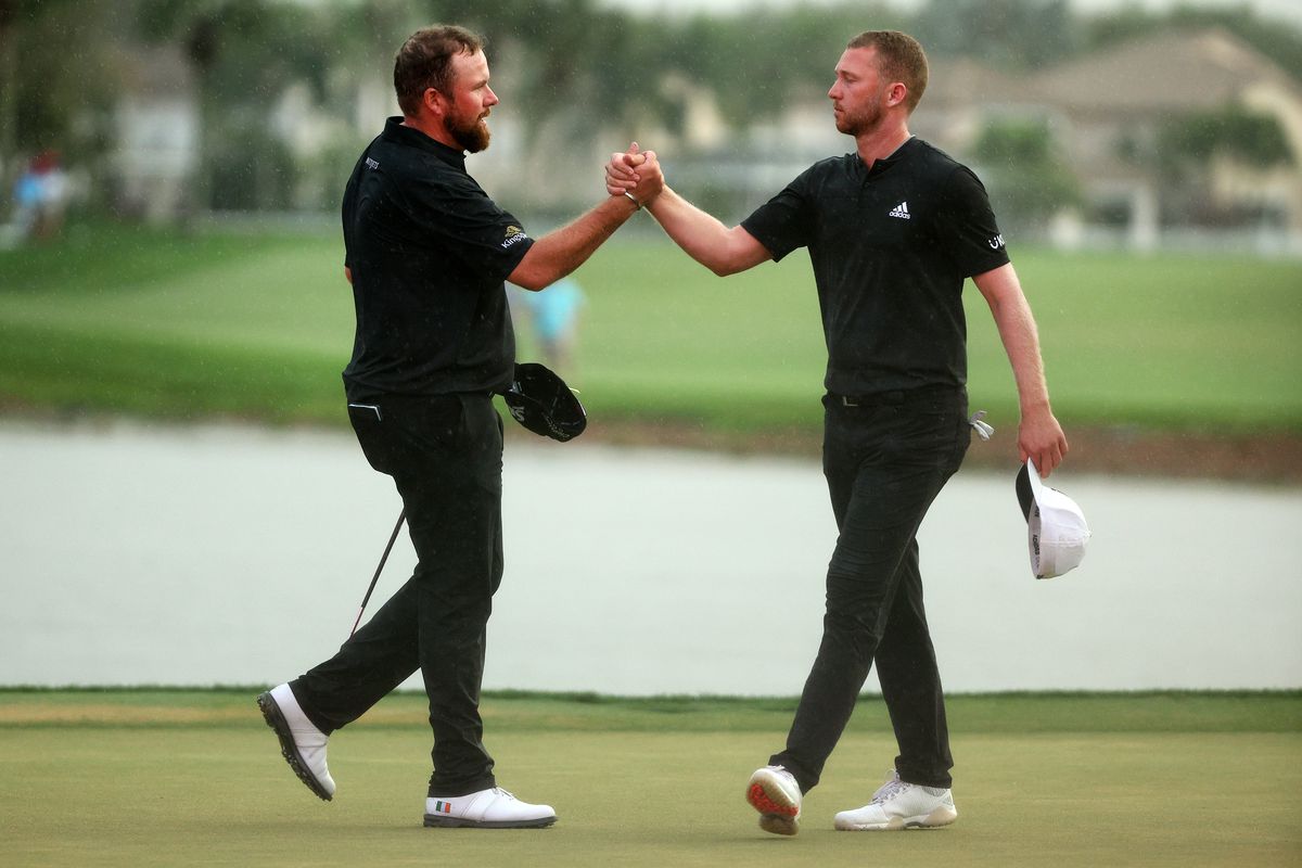 Shane Lowry of Ireland and Daniel Berger react after their round on the 18th green during the final round of The Honda Classic at PGA National Resort And Spa on February 27, 2022 in Palm Beach Gardens, Florida.