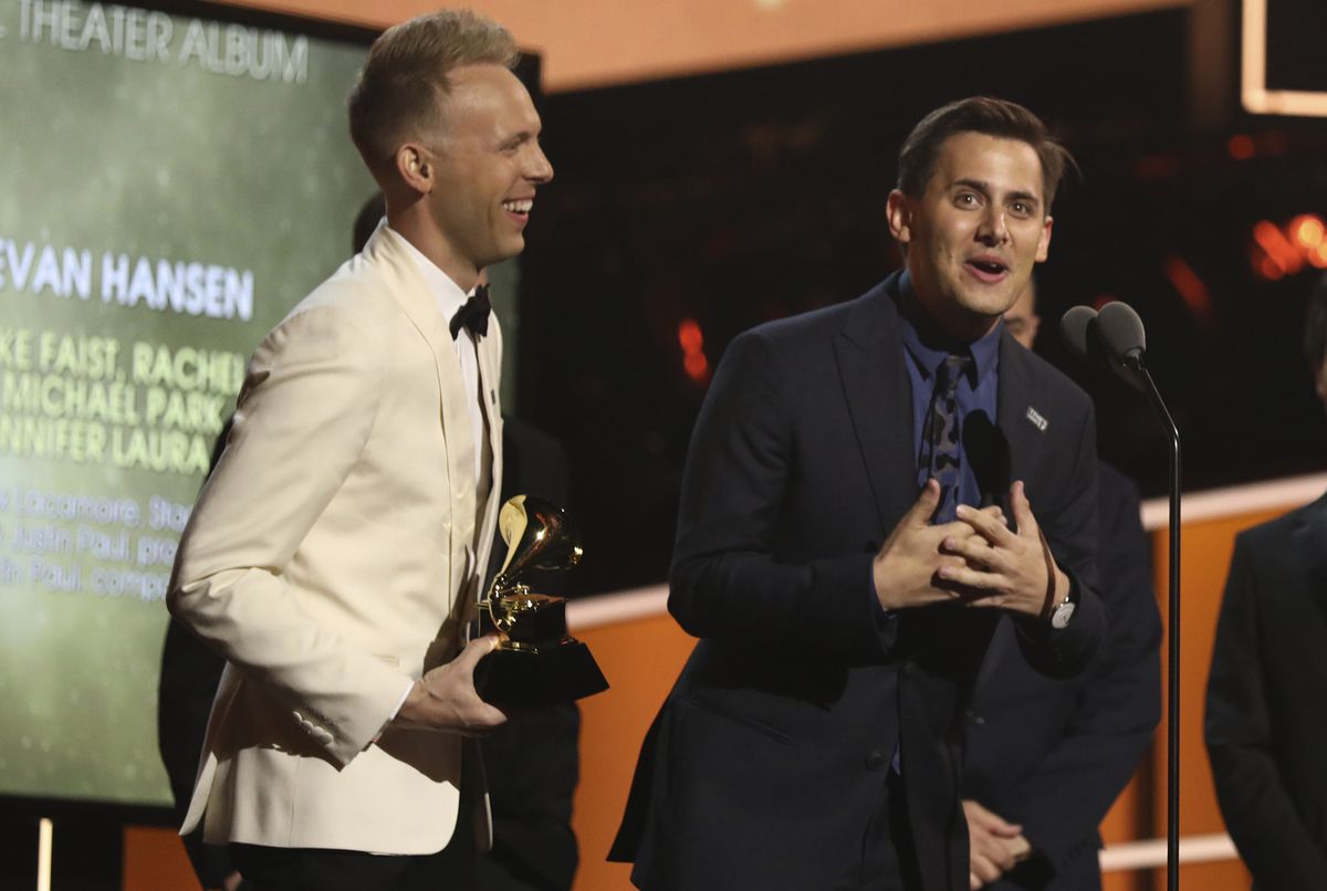 Benj Pasek, right, and Justin Paul accept the best musical theater album award for "Dear Evan Hansen" at the 60th annual Grammy Awards at Madison Square Garden on Sunday, Jan. 28, 2018, in New York. A touring production of the hit musical will come to the