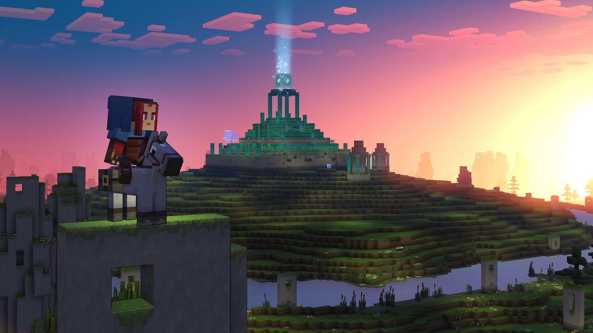 The player sits astride their horse on a grassy arch in Minecraft Legends. A big, blocky village is in the background, with a sunset turning the sky pink and orange.