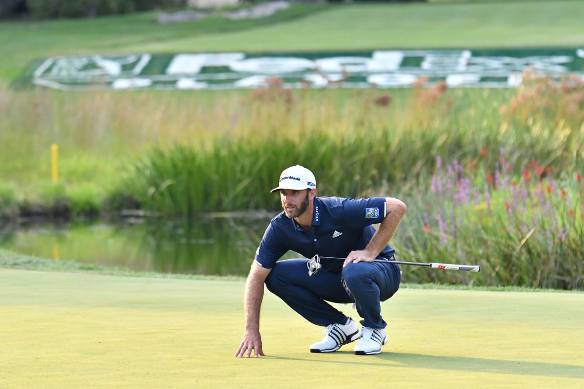 Dustin Johnson studies his putt on the 16th green during the final round of The Northern Trust golf tournament at TPC of Boston.