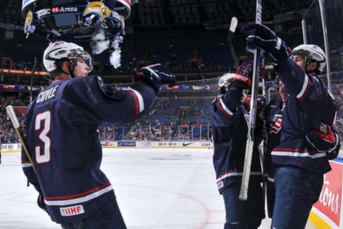 Charlie Coyle celebrates with teammates after the U.S. tied the game 1-1. Photo: Matthew Manor / HHOF-IIHF Images