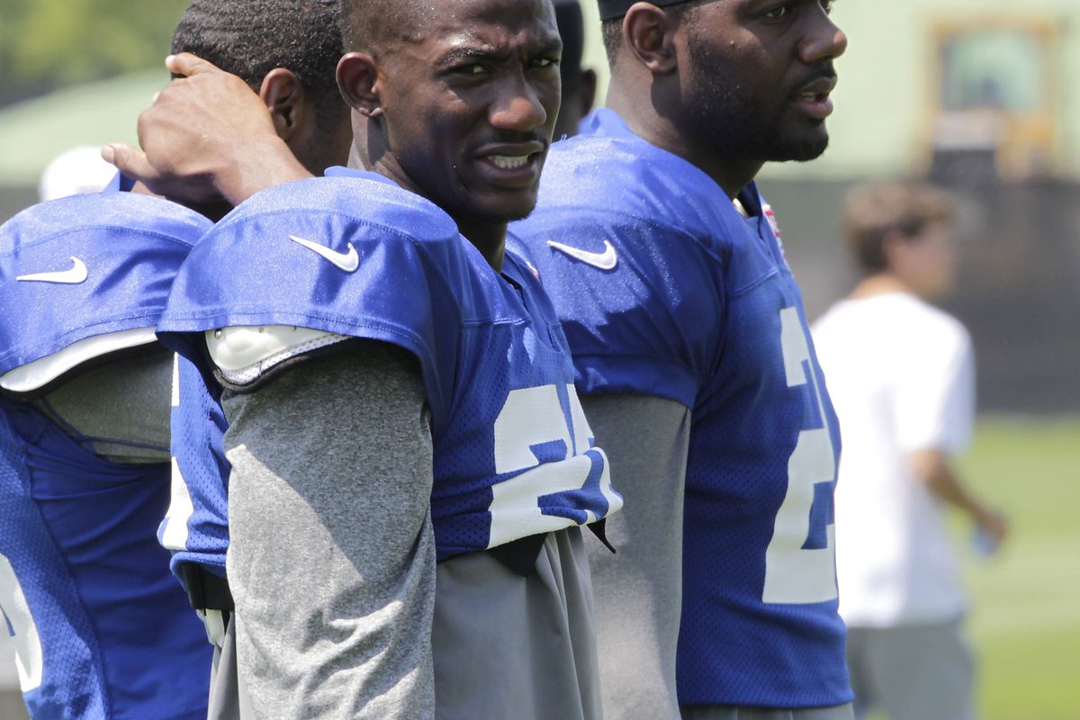 July 30, 2012; Albany, NY, USA; New York Giants Antrel Rolle (26) and Kenny Phillips (right) during New York Giants training camp. Mandatory Credit: Tim Farrell/THE STAR-LEDGER via US PRESSWIRE