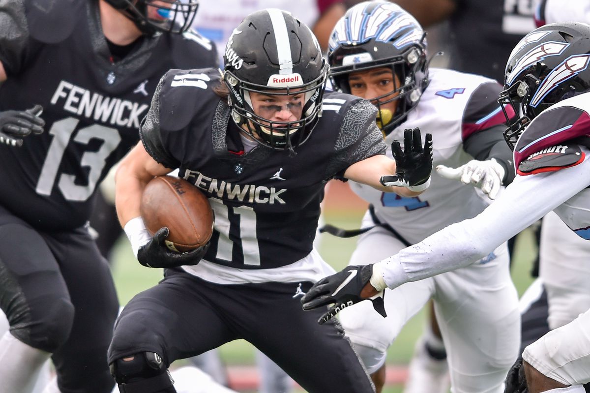 Fenwick’s Danny Kent (11) runs with the ball against Kankakee.