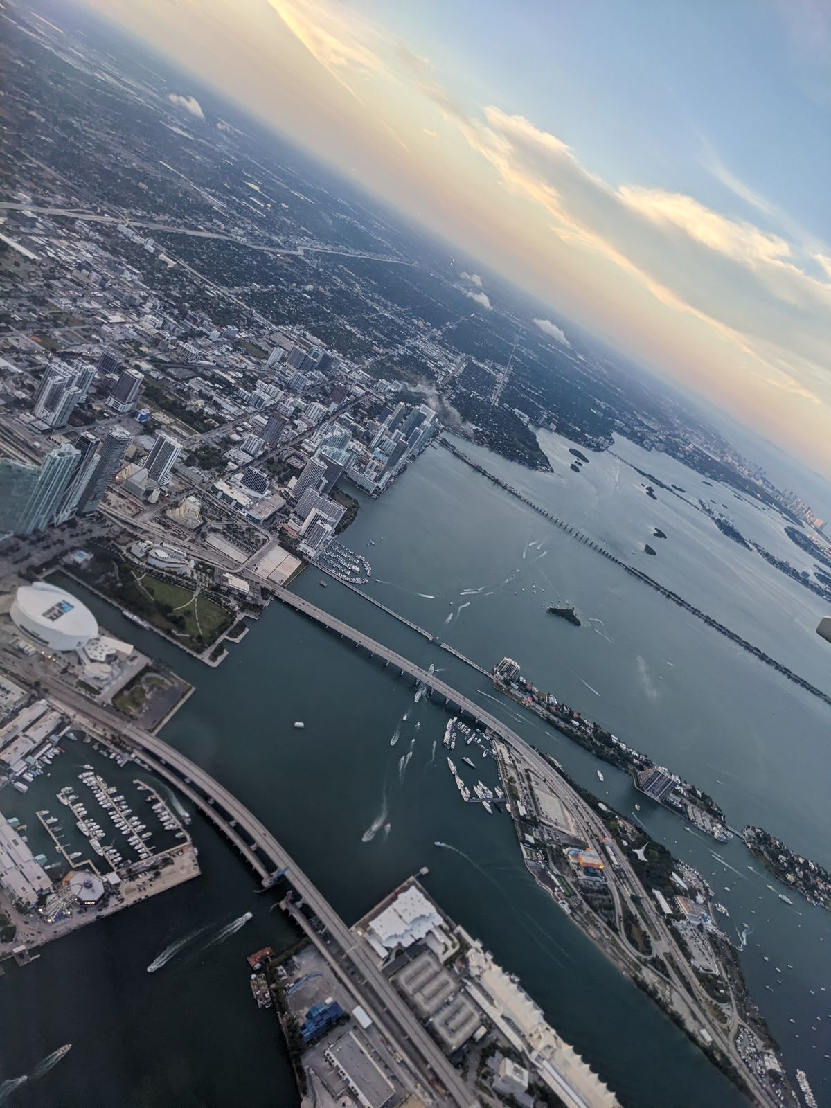 An aerial view of Miami’s shoreline, with its bridges, bays, and islands spread out below.