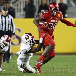 Utah Utes running back Joe Williams (28) runs out of a tackle by Indiana Hoosiers defensive back Tyler Green (3) as the Utes and the Hoosiers play in the Foster Farms Bowl in Santa Clara, California, on Wednesday, Dec. 28, 2016.