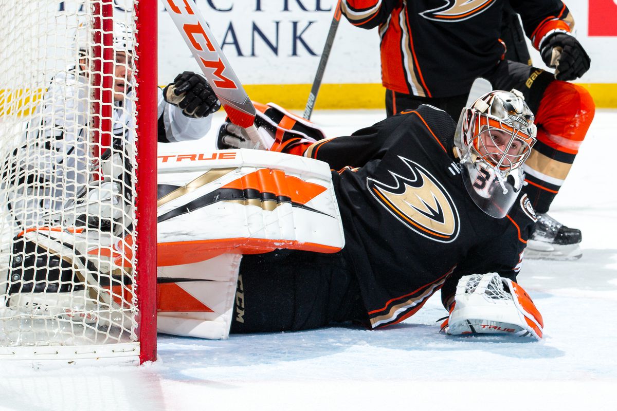Goaltender John Gibson #36 of the Anaheim Ducks lies on the ice in the crease after players collided with him during the first period of the game against the Los Angeles Kings at Honda Center on March 8, 2021 in Anaheim, California.
