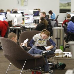 : Students study at the Marriott Library, the University of Utah needs to improve its college graduation rate according to an audit among similar-sized research institutions, the U's rate is "comparatively low" Tuesday, Nov. 29, 2011, in Salt Lake City, Utah.      