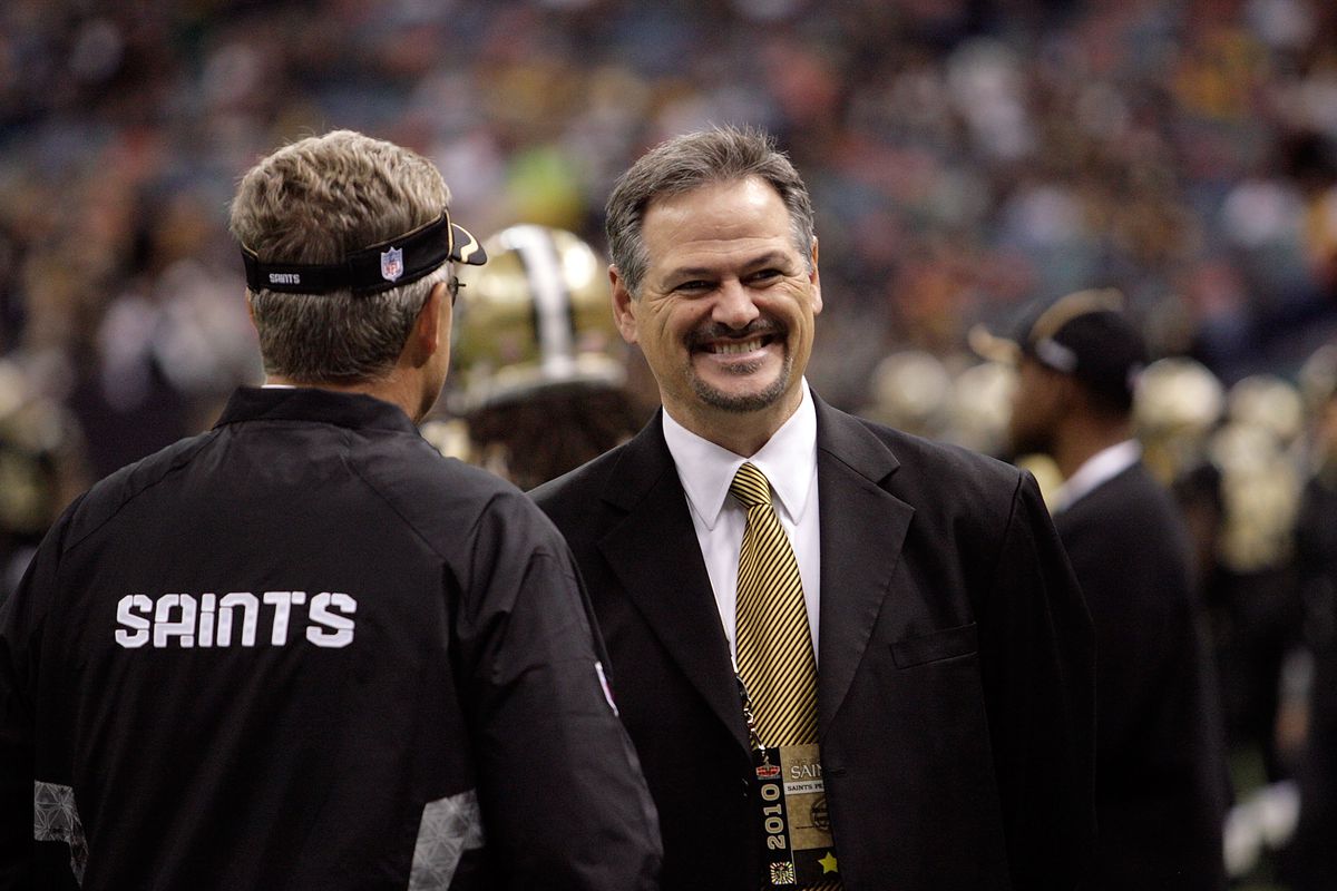 NEW ORLEANS, LA - New Orleans Saints general manager Mickey Loomis chats with members of the coaching staff before a game against the Pittsburgh Steelers at the Mercedes-Benz Superdome.