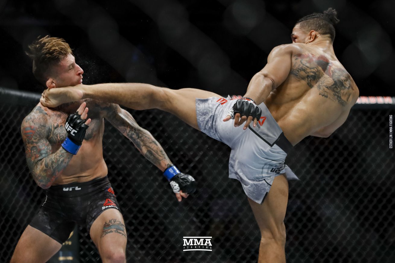Kevin Lee (right) lands a head kick on Gilbert Gillespie at UFC 244 in New ...