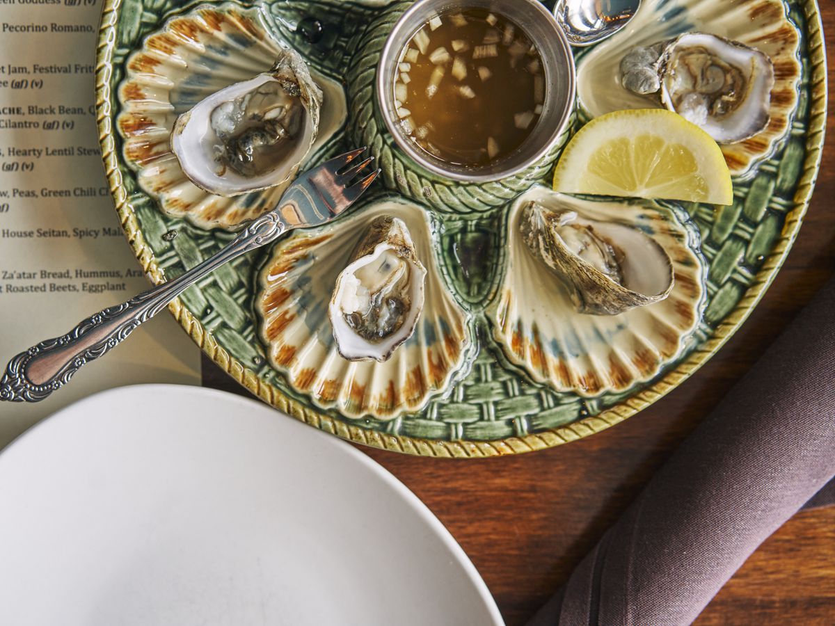 Oysters on a decorative plate.