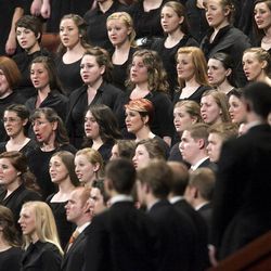 Members of a combined choir from BYU performs during the afternoon session Saturday, April 6, 2013 of the 183th Annual General Conference of The Church of Jesus Christ of Latter-day Saints in the Conference Center.