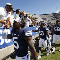 Brigham Young Cougars players high-five the fans in Provo on Saturday, Aug. 26, 2017. BYU won 20-6.