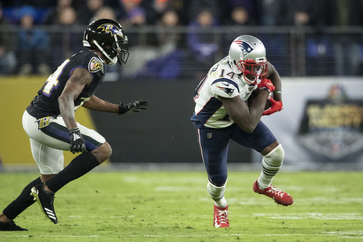 New England Patriots wide receiver Mohamed Sanu runs as Baltimore Ravens cornerback Marcus Peters defends during the fourth quarter at M&amp;T Bank Stadium.