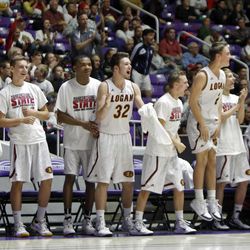 The Logan bench celebrates a goal as Logan plays Kearns in the 4A boys basketball quarterfinals at the Dee Events Center in Ogden Thursday, Feb. 26, 2015.