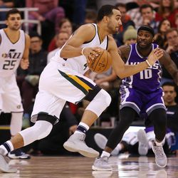 Utah Jazz forward Trey Lyles (41) drives on Sacramento Kings guard Ty Lawson (10) as the Jazz and the Kings play at Vivint Smart Home arena in Salt Lake City on Wednesday, Dec. 21, 2016.