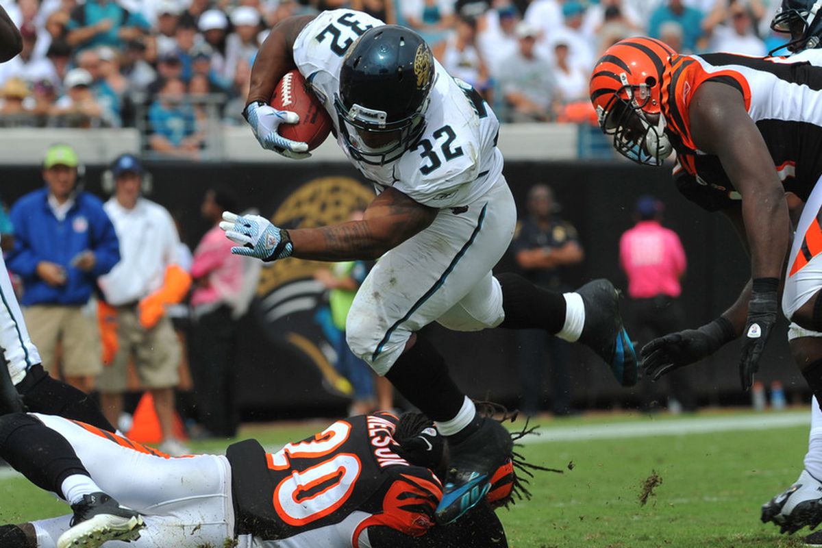 JACKSONVILLE, FL - OCTOBER 09:  Running back Cedric Benson #32  of the the Cincinnati Bengals rushes upfield against the Jacksonville Jaguars October 9, 2011 at EverBank Field in Jacksonville, Florida. (Photo by Al Messerschmidt/Getty Images)