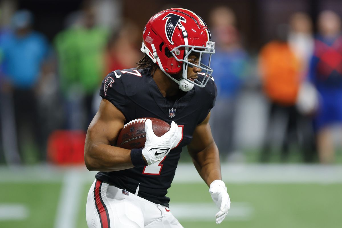Bijan Robinson of the Atlanta Falcons rushes during the first quarter against the New Orleans Saints at Mercedes-Benz Stadium on November 26, 2023 in Atlanta, Georgia.