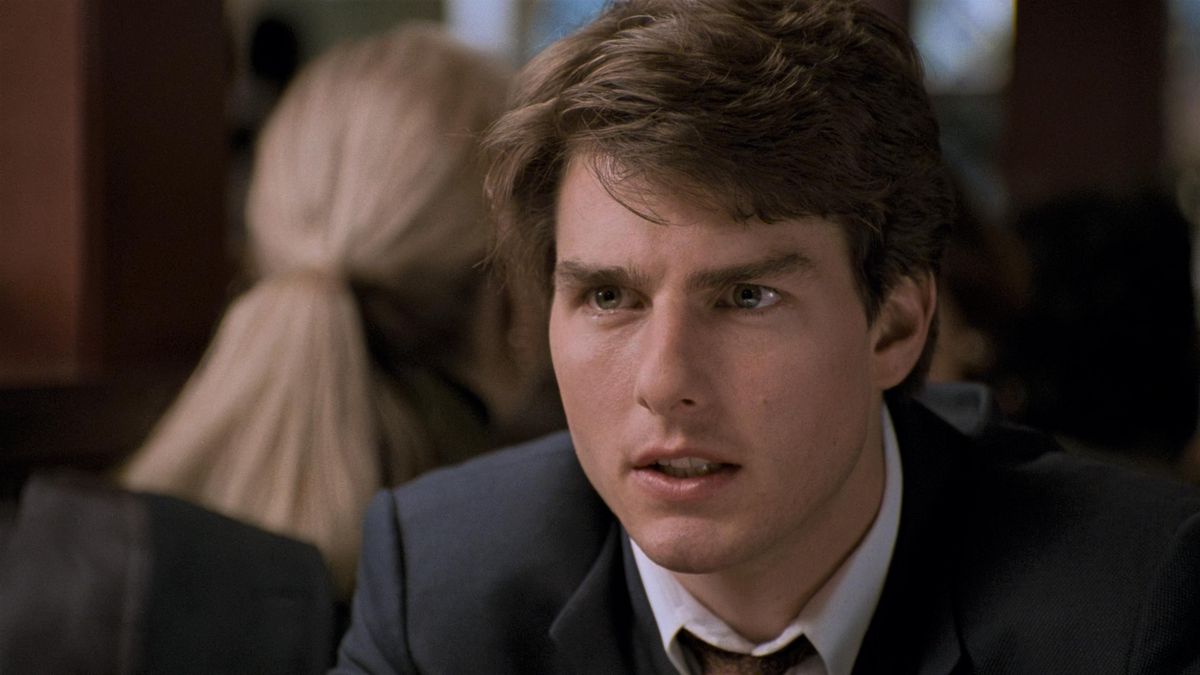 A young Tom Cruise wears a suit in THe Firm.