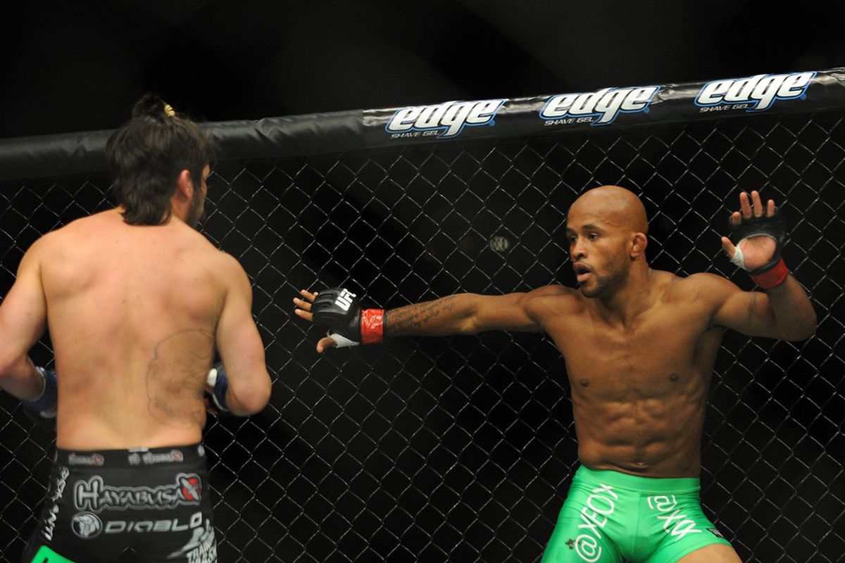 June 8, 2012; Sunrise, FL, USA; Demetrious Johnson (right) fights against Ian McCall (left) during their UFC bout at BankAtlantic Center. Mandatory Credit: Steve Mitchell-US PRESSWIRE