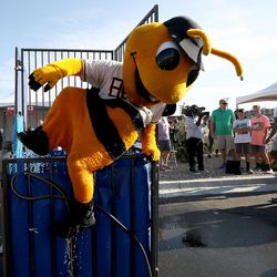 Bumble gets out of the dunk tank after being dunked by Utah Jazz guard Alec Burks at the Farmington Family Night as part of the 9th annual Be Well Utah outside of the Farmington Health Center in Farmington on Monday, Aug. 21, 2017.