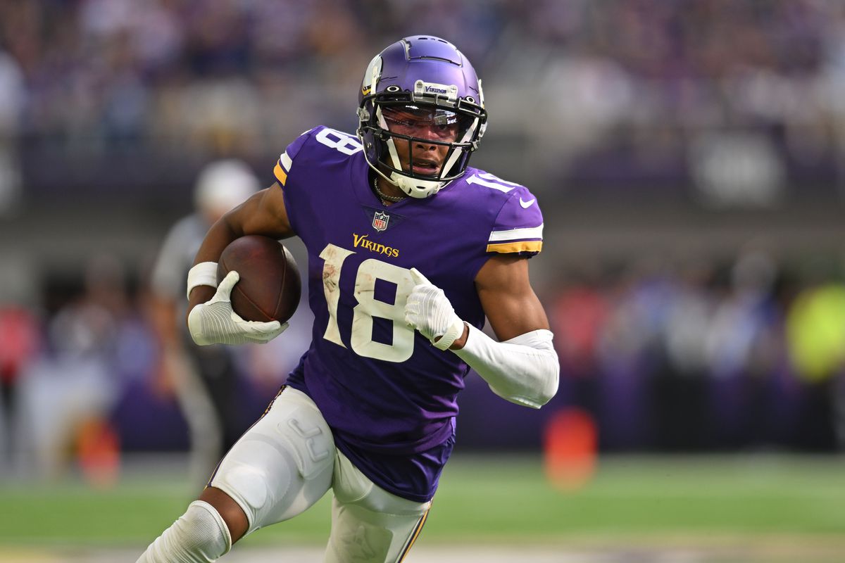 Minnesota Vikings wide receiver Justin Jefferson (18) scores a touchdown on a pass from quarterback Kirk Cousins (not pictured) against the Green Bay Packers during the second quarter at U.S. Bank Stadium.&nbsp;