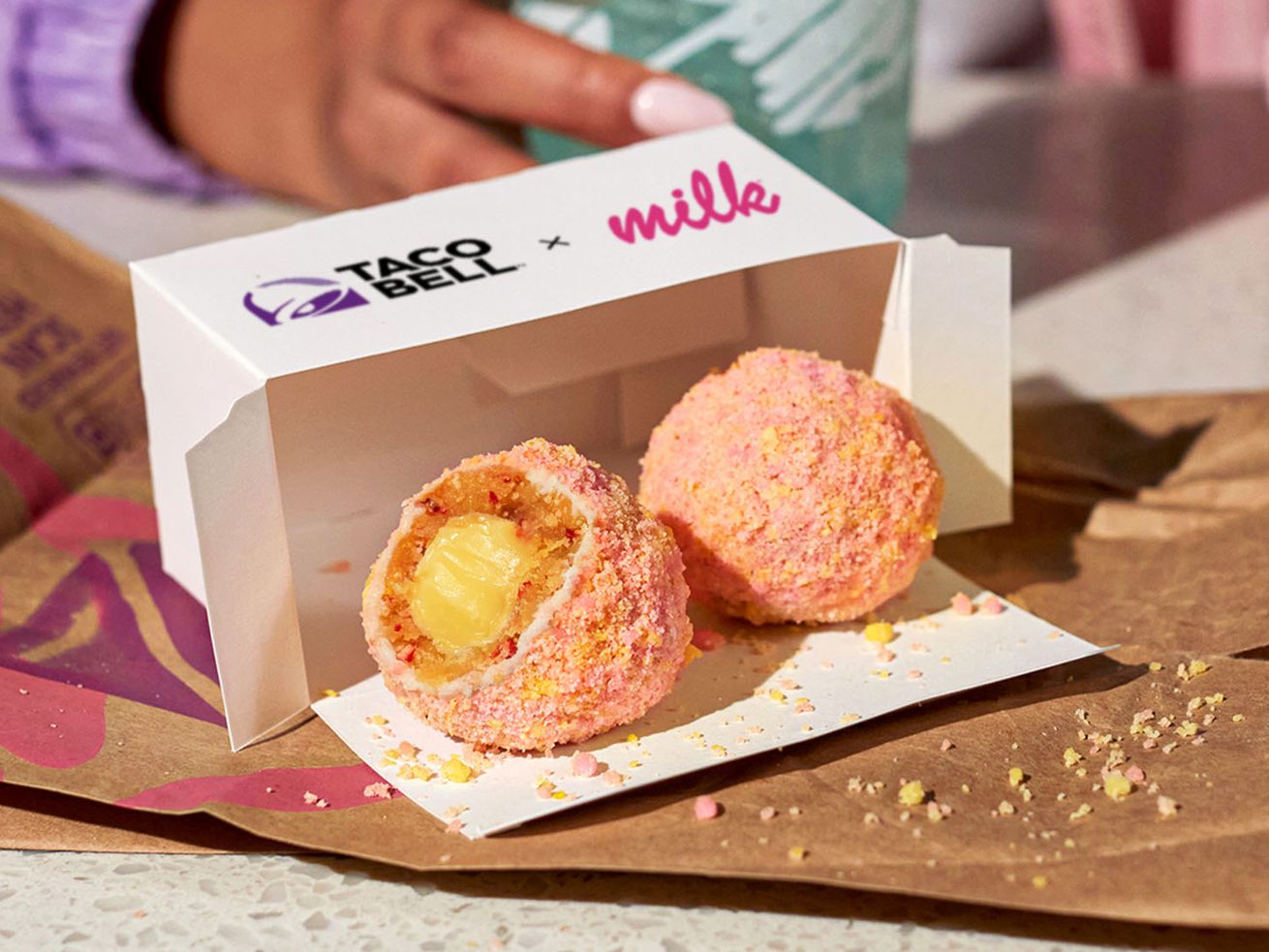 Two Taco Bell cake truffles spilling out from the box 