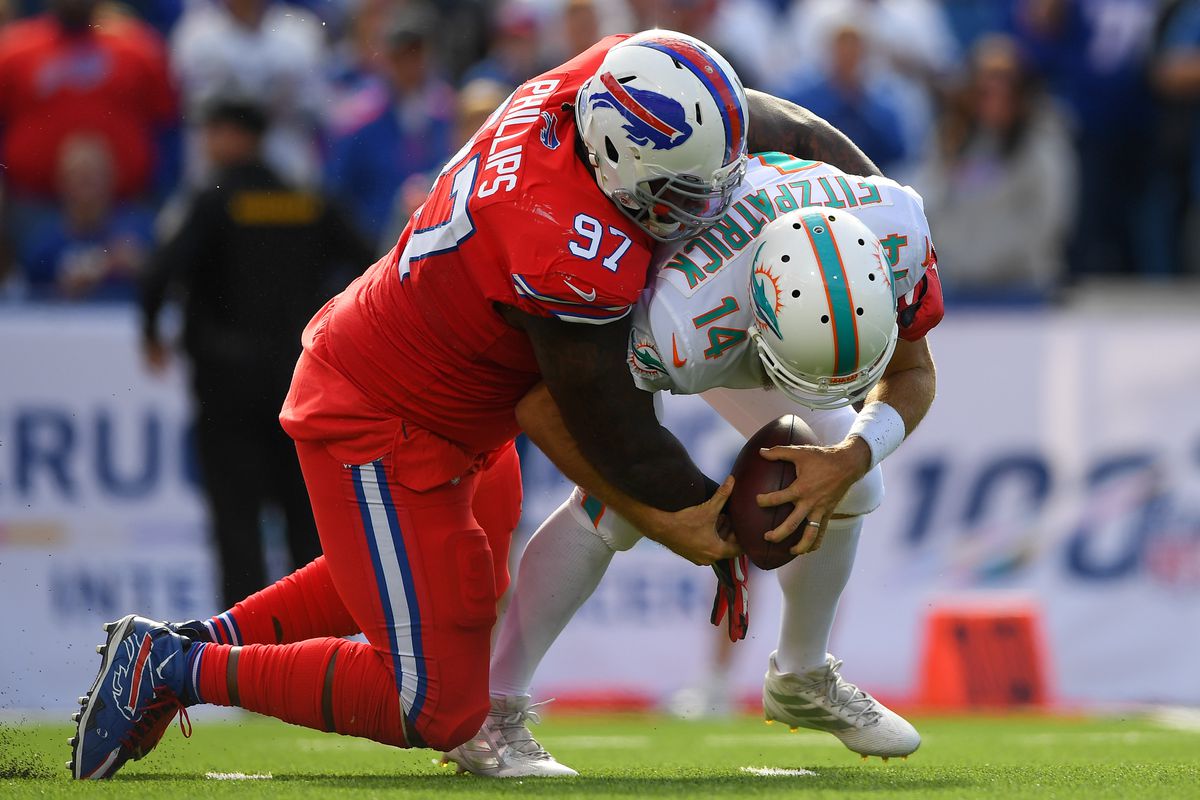 Buffalo Bills defensive tackle Jordan Phillips sacks Miami Dolphins quarterback Ryan Fitzpatrick during the third quarter at New Era Field.