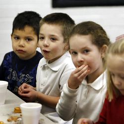 Children have a snack at the Sugar House Boys and Girls Club in Salt Lake City.