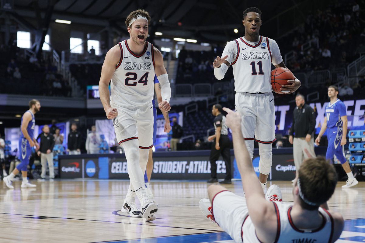 Drew Timme of the Gonzaga Bulldogs celebrates with Corey Kispert and Joel Ayayi against the Creighton Bluejays during the second half in the Sweet Sixteen round game of the 2021 NCAA Men’s Basketball Tournament at Hinkle Fieldhouse on March 28, 2021 in Indianapolis, Indiana.