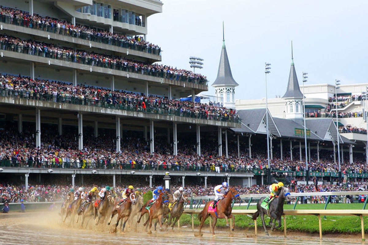 LOUISVILLE, KY - MAY 01:  Jockey Martin Garcia atop Conveyance leads the field around turn one during the 136th running of the Kentucky Derby on May 1, 2010 in Louisville, Kentucky.  (Photo by Matthew Stockman/Getty Images)