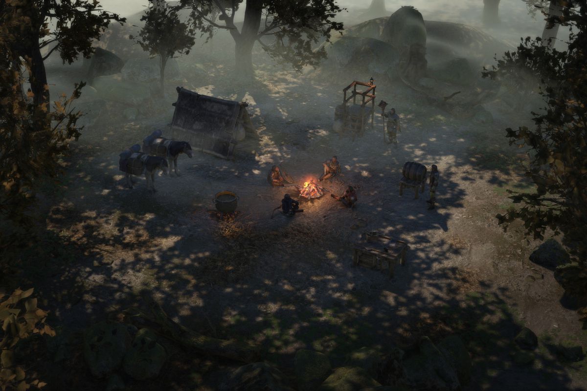 A party of heroes in Wartales lounge around a campfire in a forest glade. Work stations are set up around the camp to allow for extra duties.
