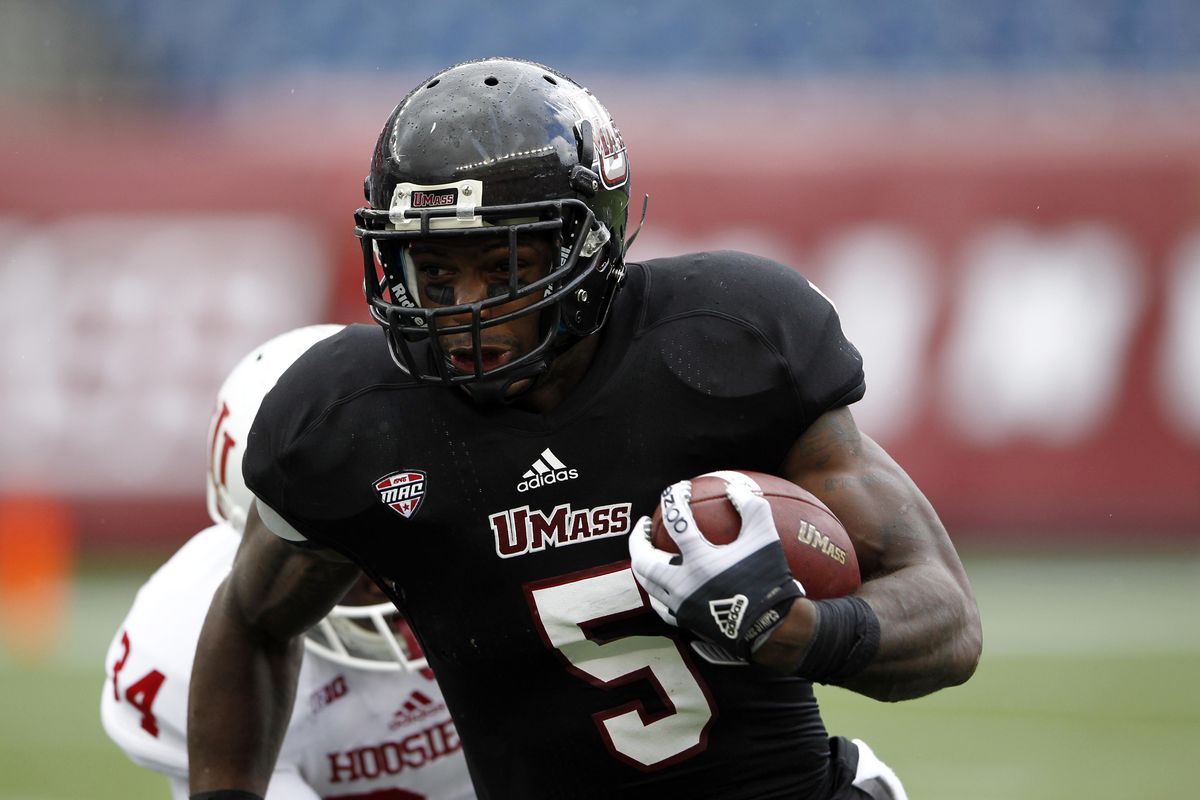 Sep 8, 2012; Foxborough, MA, USA; Massachusetts Minutemen running back Michael Cox (5) runs the ball against the Indiana Hoosiers during the first half at Gillette Stadium.  Mandatory Credit: Mark L. Baer-US PRESSWIRE