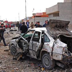 FILE - in this file photo taken on Jan. 16, 2012 Iraqi security forces inspect the scene of a car bomb attack outside the northern city of Mosul, 225 miles (360 kilometers) northwest of Baghdad, Iraq. Al-Qaida's Iraq arm is gaining strength in the restive northern city of Mosul, reviving its fundraising efforts through gangland-style shakedowns, feeding off anti-government anger and increasingly carrying out attacks with impunity. It is a worrying development for Iraq's third-largest city, one of its main gateways to Syria, as voters prepare to cast ballots for local leaders and al-Qaida makes a push to establish itself as a dominant force among the rebels fighting to topple the Syrian regime. (AP Photo, File)